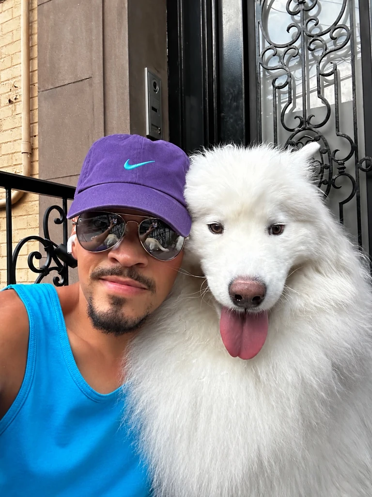 Will and a Samoyed together on a stoop